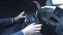 Simultaneously pressing two buttons, one to either side of the steering wheel, will engage autonomous driving mode in Volkswagen's prototype of a future car interface, James 2025, shown at the opening ceremony of Cebit 2014.