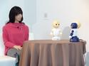 Japanese android Otonaroid (left) holds a press conference at the Miraikan technology museum in Tokyo on Tuesday, introducing tabletop conversation robots developed by the Japan Science and Technology Agency, Osaka University and Vstone, an Osaka-based robot firm.