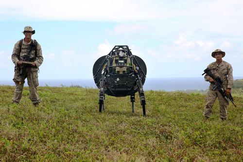 Google's LS-3 robot is put through its paces by Lance Cpl. Brandon Dieckmann, (left) and Pfc. Huberth Duarte of India Company, 3rd Battalion, 3rd Marine Regiment, U.S. Marines, at Kahuku Training Area on Oahu, Hawaii, July 12, 2014.