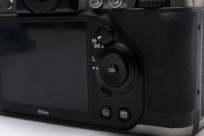 The rear of the camera has more common features for navigating the system menu and playback, though you do also get a tactile metering control.