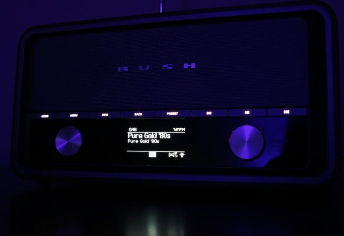 The screen displaying digital radio content at night.