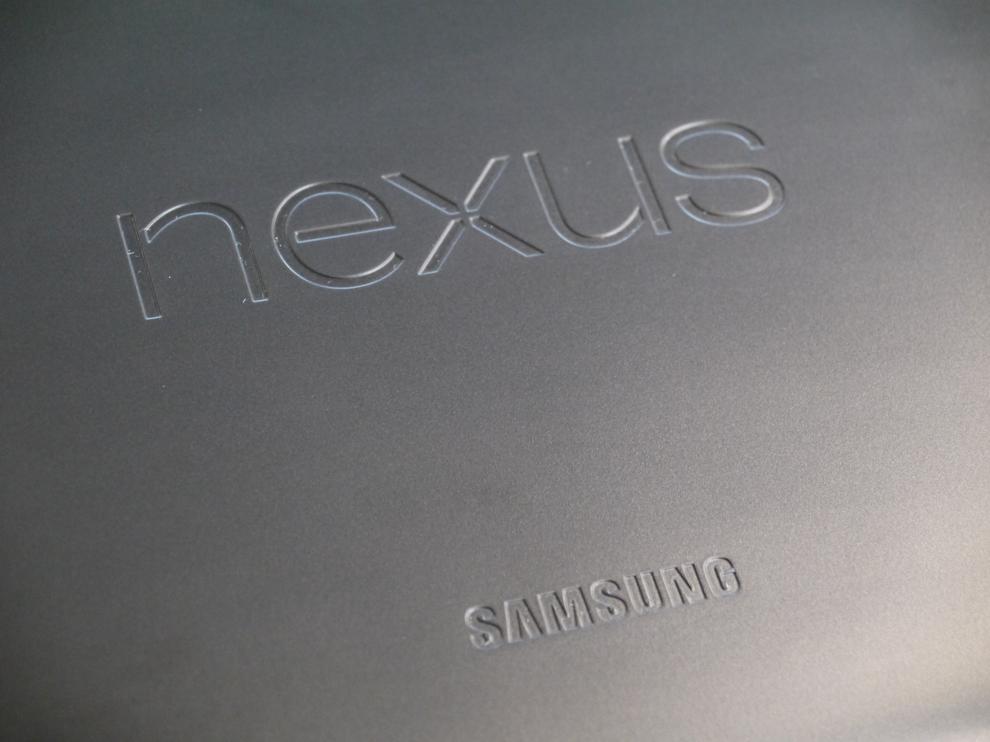 The Nexus and Samsung logos on the back are carved into the smooth plastic surface.