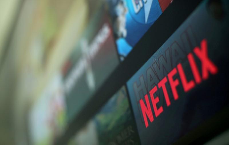 The Netflix logo is pictured on a television in this illustration photograph taken in Encinitas, California, U.S., January 18, 2017. REUTERS/Mike Blake/File Photo